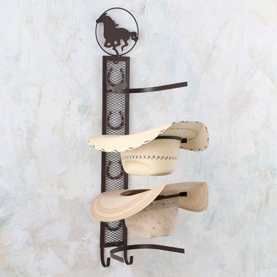 Cowboy hat hook for wall outlet
